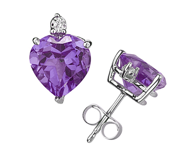 These wonderful earrings feature two lovely all natural 10mm Heart Amethyst gemstones prong set in 14K White Gold. A pair of dazzling white diamonds give a dash of sparkling brilliance to these earrings, making them a jewelry essential perfect for almost any occasion. Diamond weight 0.06 Color J-K-L, Clarity I2-I3. A spectacular look that will be treasured forever. The earrings come standard with push back posts but can be upgraded to screw back posts for an additional charge by contacting our Customer Service Department