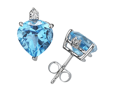 These wonderful earrings feature two lovely all natural 10mm Heart Blue Topaz gemstones prong set in 14K White Gold. A pair of dazzling white diamonds give a dash of sparkling brilliance to these earrings, making them a jewelry essential perfect for almost any occasion. Diamond weight 0.06 Color J-K-L, Clarity I2-I3. A spectacular look that will be treasured forever. The earrings come standard with push back posts but can be upgraded to screw back posts for an additional charge by contacting our Customer Service Department