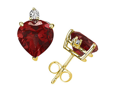 These wonderful earrings feature two lovely all natural 10mm Heart Garnet gemstones prong set in 14K Yellow Gold. A pair of dazzling white diamonds give a dash of sparkling brilliance to these earrings, making them a jewelry essential perfect for almost any occasion. Diamond weight 0.06 Color J-K-L, Clarity I2-I3. A spectacular look that will be treasured forever. The earrings come standard with push back posts but can be upgraded to screw back posts for an additional charge by contacting our Customer Service Department