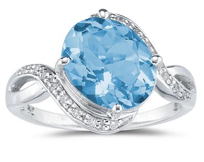 Oval Shaped Blue Topaz and Diamond Curve Ring in 10K White Gold
